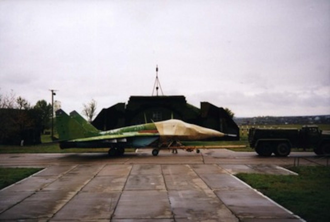 A nuclear-capable MiG-29C is readied for air shipment from Moldova to the United States on Oct. 17, 1997. The Department of Defense of the United States of America and the Ministry of Defense of the Republic of Moldova recently reached an agreement to implement the Cooperative Threat Reduction accord signed on June 23, 1997, in Moldova. This agreement authorized the United States Government to purchase nuclear-capable MiG-29 fighter planes from the Government of Moldova. This is a joint effort by both governments to ensure that these dual-use military weapons do not fall in to the hands of rogue states. 
