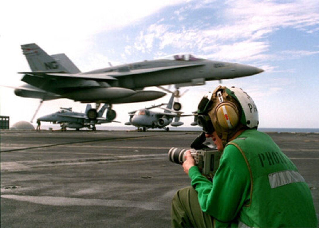 U.S. Navy Photographer's Mate Airman Benjamin Story uses a Hi-8 video camera to document daily flight operations on the flight deck of the aircraft carrier USS Nimitz (CVN 68) in the Persian Gulf on Nov. 6, 1997. The Nimitz and embarked Carrier Air Wing 9 are operating in the Persian Gulf in support of the U.S. and coalition enforcement of the no-fly-zone over Southern Iraq. Story, from Pomfret, Md., is assigned to the Operations Department, Photographic Division. 