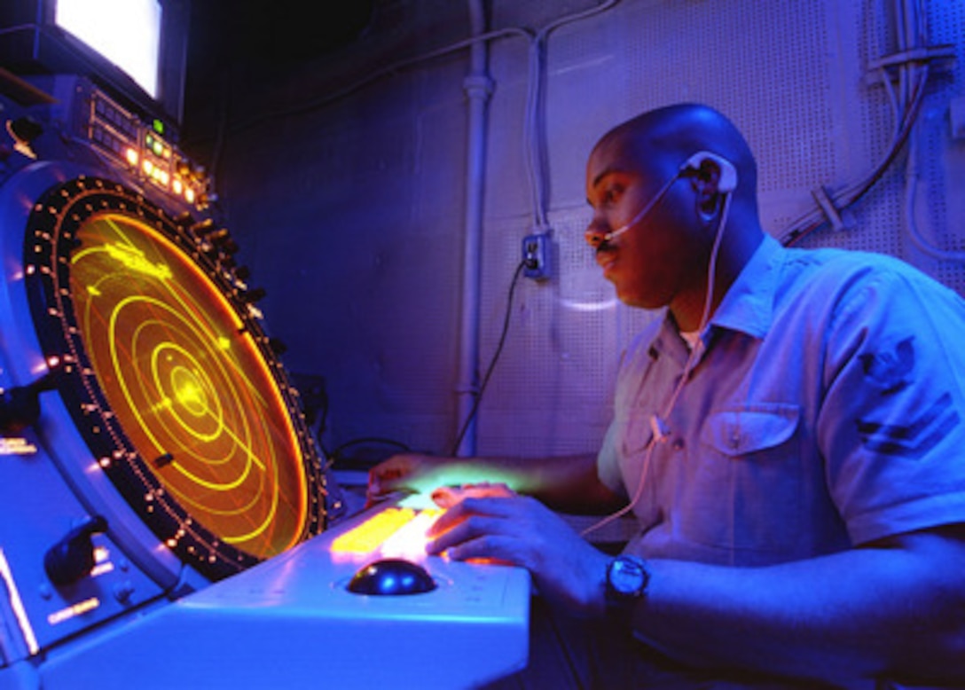 Petty Officer 2nd Class Mark McDaniel, a Navy air traffic controlman, directs strike fighter and support aircraft during flight operations from the aircraft carrier USS Nimitz (CVN 68) on Nov. 16, 1997. The Nimitz and embarked Carrier Air Wing 9 are operating in the Persian Gulf in support of Operation Southern Watch which is the U.S. and coalition enforcement of the no-fly-zone over Southern Iraq. McDaniel is from Cleveland, Ohio. 