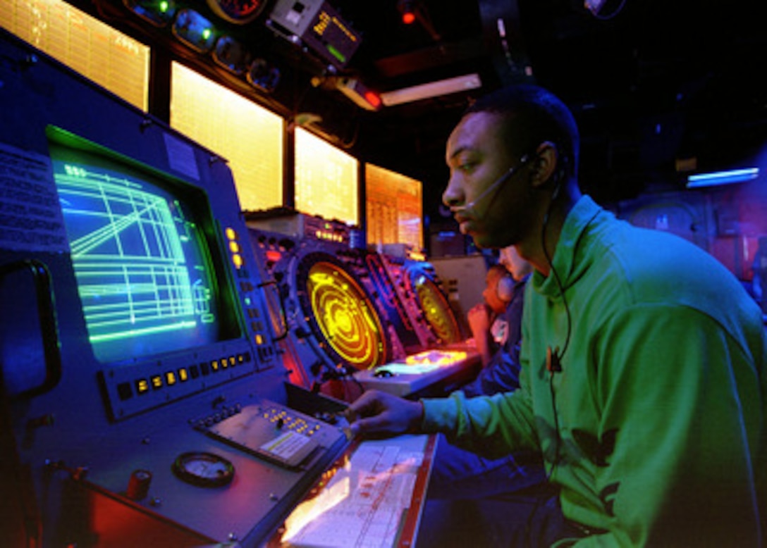 Petty Officer 2nd Class Buccie Cline, a Navy air traffic controlman, monitors final control positions of pilots during flight operations from the aircraft carrier USS Nimitz (CVN 68) on Nov. 16, 1997. The Nimitz and embarked Carrier Air Wing 9 are operating in the Persian Gulf in support of Operation Southern Watch which is the U.S. and coalition enforcement of the no-fly-zone over Southern Iraq. Cline is from Humphrey, Ariz. 