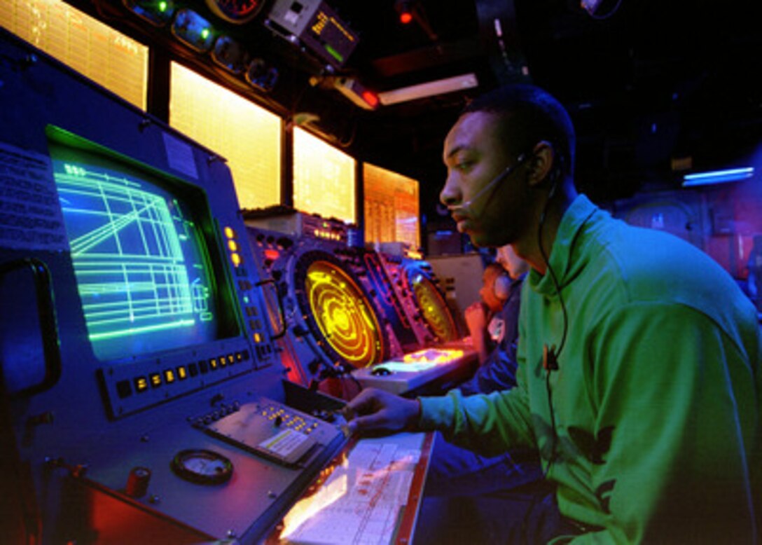 Petty Officer 2nd Class Buccie Cline, a Navy air traffic controlman, monitors final control positions of pilots during flight operations from the aircraft carrier USS Nimitz (CVN 68) on Nov. 16, 1997. The Nimitz and embarked Carrier Air Wing 9 are operating in the Persian Gulf in support of Operation Southern Watch which is the U.S. and coalition enforcement of the no-fly-zone over Southern Iraq. Cline is from Humphrey, Ariz. 