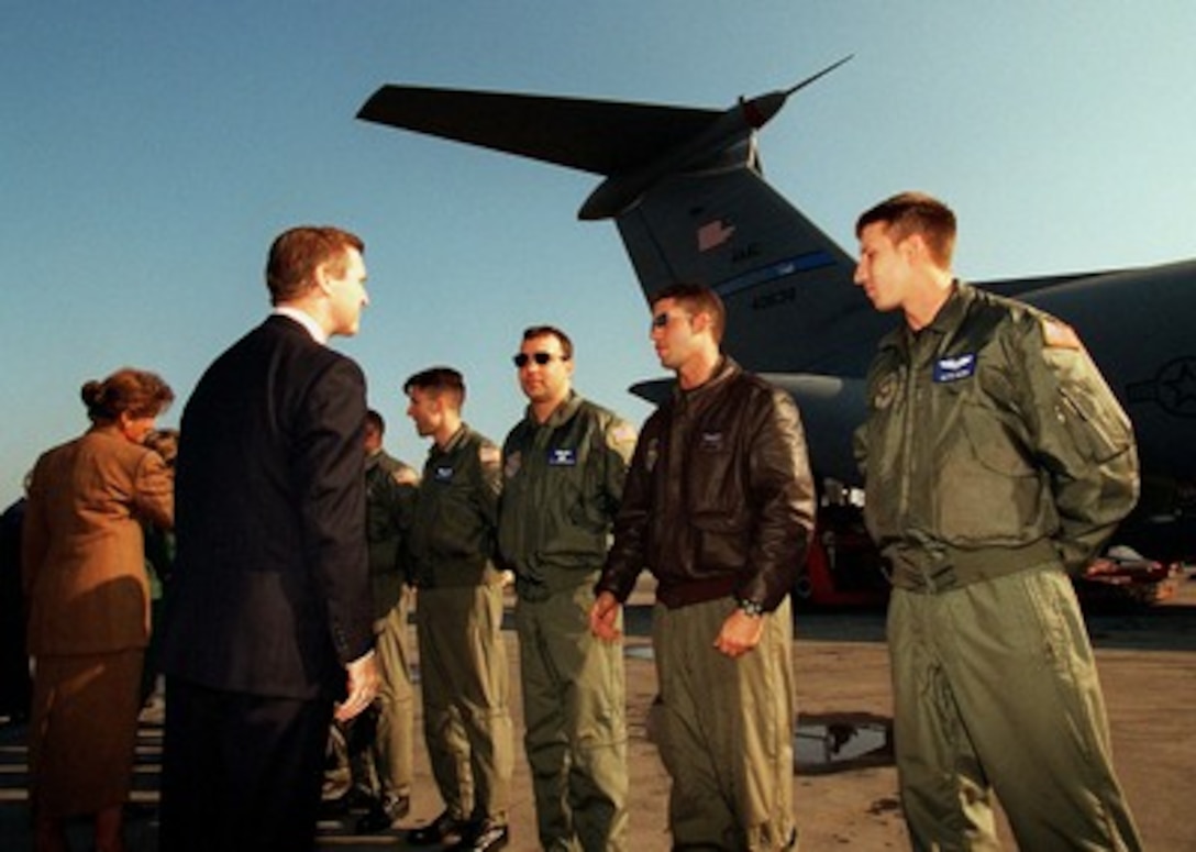 Secretary of Defense William S. Cohen meets with the crew of a U.S. Air Force C-141 Starlifter aircraft delivering excess medical goods from the United States to Bulgarian non-governmental organizations on Oct. 3, 1997. Cohen is in Sofia, Bulgaria, to take part in the Southeastern European Defense Ministerial. The Bulgarian Minister of Foreign Affairs, Minister of Health, Minister of Defense and heads of organizations receiving the goods, assembled at Vrazhdebna Airport to pay tribute to the United States for their humanitarian efforts. 