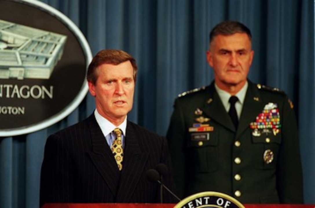 Secretary of Defense William S. Cohen accompanied by Chairman of the Joint Chiefs of Staff Gen. Henry H. Shelton, U.S. Army, conducts a press briefing on the deployment of the aircraft carrier USS George Washington (CVN 73) and its battle group to the Persian Gulf on Nov. 14, 1997. The battle group has been ordered to the Persian Gulf to join the aircraft carrier USS Nimitz (CVN 68) battle group already on station. The two battle groups will be operating in the Persian Gulf in support of Operation Southern Watch which is the U.S. and coalition enforcement of the no-fly-zone over Southern Iraq. 
