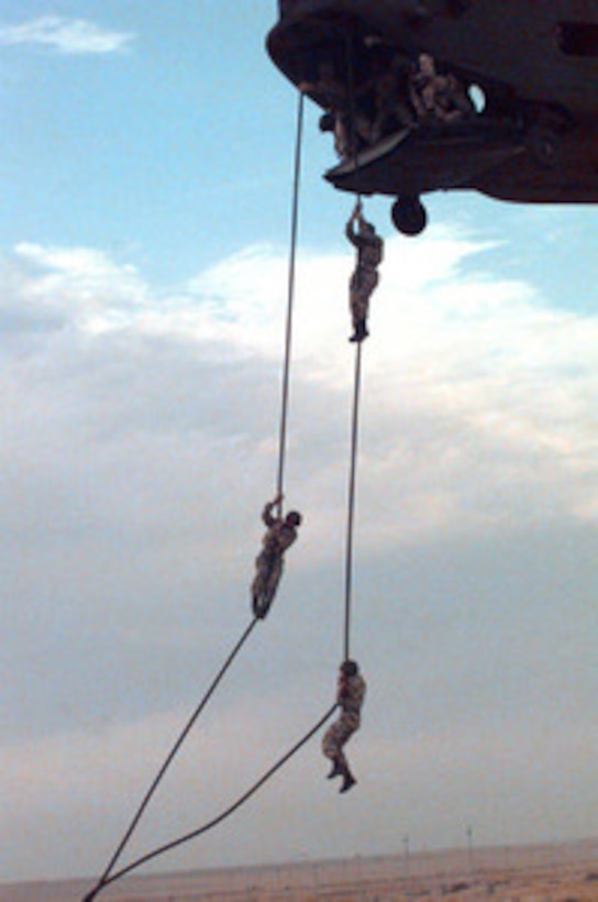 Soldiers from the U.S., Egypt and United Arab Emirates practice fast roping from a helicopter during Exercise Bright Star 98 at the Mubarek Military City compound outside Cairo, Egypt, on Oct. 16, 1997. Bright Star 98 is a joint/combined coalition tactical air, ground, naval and special operations forces field training exercise in Egypt. Members of the U.S. Central Command's Army, Air Force, Navy, Marine and special operations components, and members of the Air and Army National Guard, and forces from Egypt, the United Arab Emirates, Kuwait, France, Italy and the United Kingdom are taking part in the exercise. The exercise is intended to improve readiness and interoperability between U.S., Egyptian and coalition forces. 