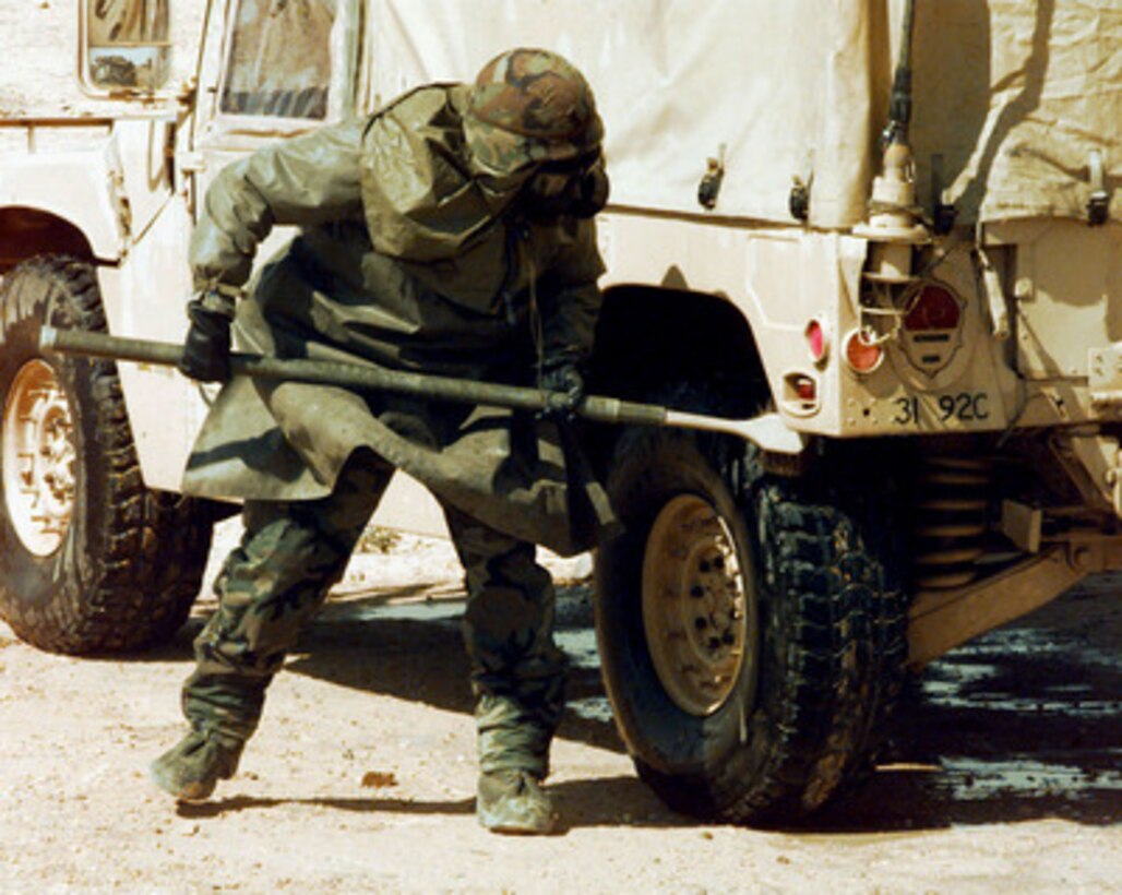 A U.S. Army soldier scrubs a Humvee as part of decontamination training during Exercise Bright Star 98 at the Mubarek Military City compound outside Cairo, Egypt, on Oct. 19, 1997. Bright Star 98 is a joint/combined coalition tactical air, ground, naval and special operations forces field training exercise in Egypt. Members of the U.S. Central Command's Army, Air Force, Navy, Marine and special operations components, and members of the Air and Army National Guard, and forces from Egypt, the United Arab Emirates, Kuwait, France, Italy and the United Kingdom are taking part in the exercise. The exercise is intended to improve readiness and interoperability between U.S., Egyptian and coalition forces. 