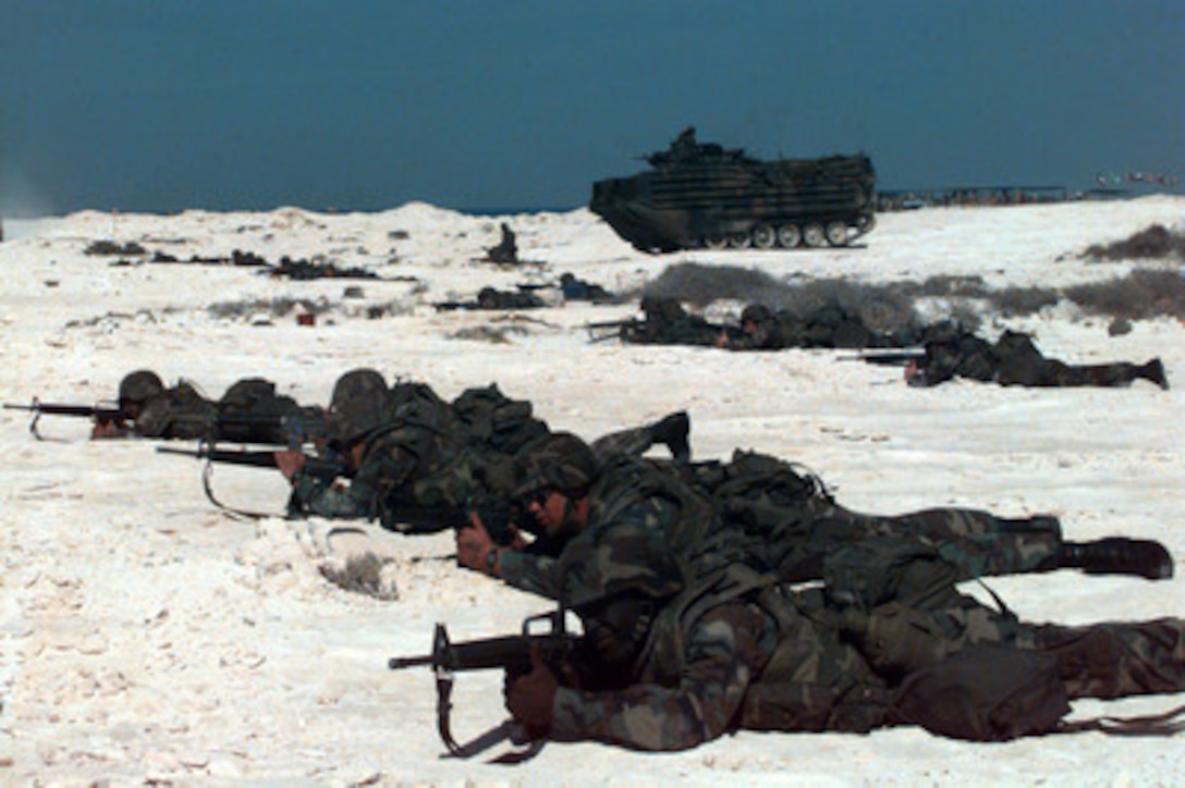 U.S. Marines from the 24th Marine Expeditionary Unit deploy to establish a firing line during an amphibious landing at Abd-el Kerim beach on Egypt's Mediterranean coast for Exercise Bright Star 98 on Oct. 25, 1997. Bright Star 98 is a joint/combined coalition tactical air, ground, naval and special operations forces field training exercise in Egypt. Members of the U.S. Central Command's Army, Air Force, Navy, Marine and special operations components, and members of the Air and Army National Guard, and forces from Egypt, the United Arab Emirates, Kuwait, France, Italy and the United Kingdom are taking part in the exercise. The exercise is intended to improve readiness and interoperability between U.S., Egyptian and coalition forces. The 24th MEU is deployed with the USS Guam Amphibious Ready Group. 