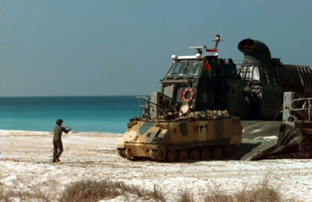 An Egyptian armored personnel carrier is directed off of a U.S. Navy Landing Craft Air Cushioned during an amphibious landing at Abd-el Kerim beach on Egypt's Mediterranean coast for Exercise Bright Star 98 on Oct. 25, 1997. Bright Star 98 is a joint/combined coalition tactical air, ground, naval and special operations forces field training exercise in Egypt. Members of the U.S. Central Command's Army, Air Force, Navy, Marine and special operations components, and members of the Air and Army National Guard, and forces from Egypt, the United Arab Emirates, Kuwait, France, Italy and the United Kingdom are taking part in the exercise. The exercise is intended to improve readiness and interoperability between U.S., Egyptian and coalition forces. The Landing Craft Air Cushioned, or LCAC as it is more commonly called, is deployed with the USS Guam Amphibious Ready Group. 