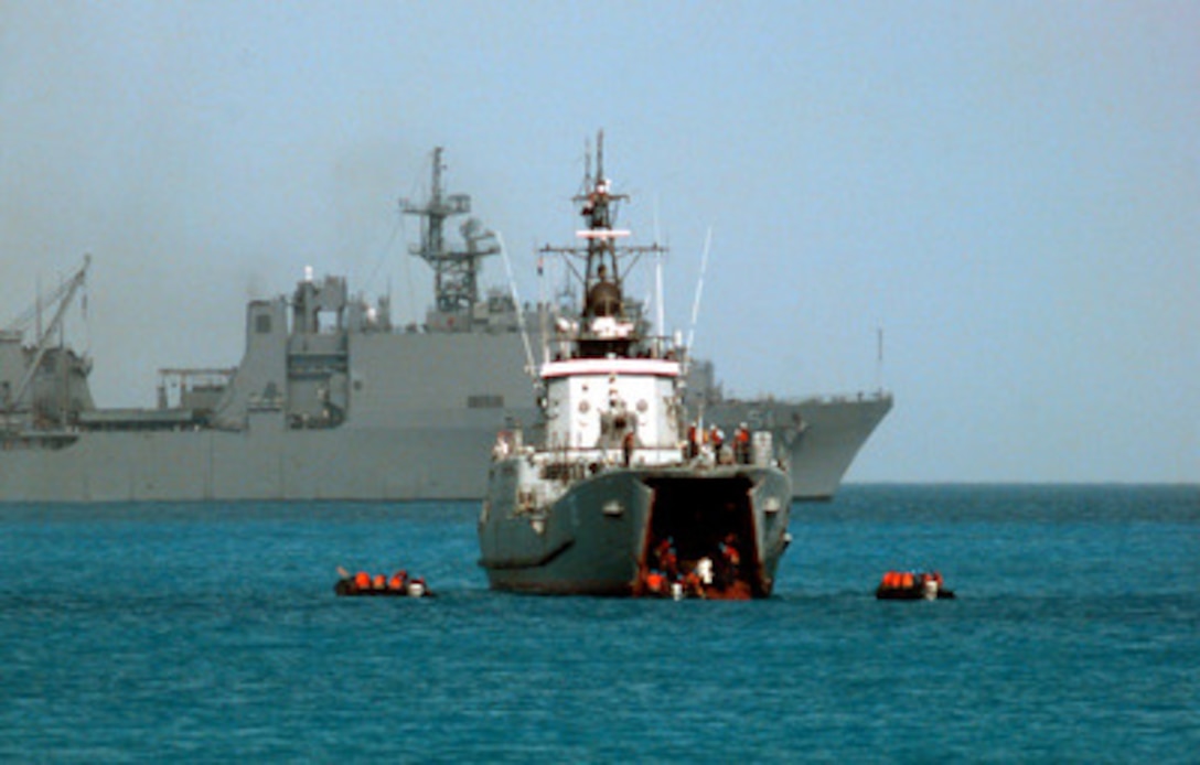 Egyptian commandos use one of their ships to launch combat rubber raiding craft for an amphibious landing at Abd-el Kerim beach on Egypt's Mediterranean coast during Exercise Bright Star 98 on Oct. 25, 1997. Bright Star 98 is a joint/combined coalition tactical air, ground, naval and special operations forces field training exercise in Egypt. Members of the U.S. Central Command's Army, Air Force, Navy, Marine and special operations components, and members of the Air and Army National Guard, and forces from Egypt, the United Arab Emirates, Kuwait, France, Italy and the United Kingdom are taking part in the exercise. The exercise is intended to improve readiness and interoperability between U.S., Egyptian and coalition forces. The dock landing ship USS Oak Hill (LSD 51) is anchored in the background. 
