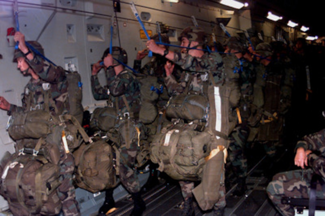 Soldiers from the U.S. Army's 82nd Airborne Division line up in a U.S. Air Force C-17 Globemaster III to parachute into a drop zone located in Sayram, Kazakhstan, on Sept. 15, 1997. The parachute jump is the culmination of the longest distance airborne operation in history for Exercise Central Asian Battalion '97. Exercise Central Asian Battalion '97 involves more than 900 military personnel from Georgia, Kazakhstan, Kyrgyzstan, Latvia, Russia, Ukraine and Uzbekistan who are training with over 500 U.S. military troops to hone their skills in peacekeeping and humanitarian assistance. The exercise will enhance regional cooperation and increase interoperability training among NATO and Partnership for Peace nations. The exercise is being held in Shymkent, Kazakhstan, and Chirchik, Uzbekistan. 