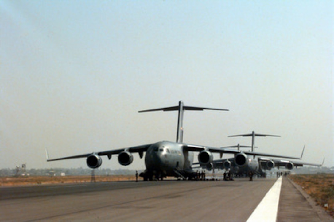U.S. Air Force C-17 Globemaster III line up at Tashkent International Airport, in Uzbekistan, after parachute dropping Kazakhstan, U.S., and Uzbekistan soldiers to a drop zone in Sayram, Kazakhstan, on Sept. 15, 1997. The aircraft have just completed the longest distance airborne operation in history, flying from Pope Air Force Base, N.C. to Kazakhstan for Exercise Central Asian Battalion '97. Exercise Central Asian Battalion '97 involves more than 900 military personnel from Georgia, Kazakhstan, Kyrgyzstan, Latvia, Russia, Ukraine and Uzbekistan who are training with over 500 U.S. military troops to hone their skills in peacekeeping and humanitarian assistance. The exercise will enhance regional cooperation and increase interoperability training among NATO and Partnership for Peace nations. The exercise is being held in Shymkent, Kazakhstan, and Chirchik, Uzbekistan. The Globemasters are deployed from the 14th, 17th and 317th Airlift Squadrons, Charleston Air Force Base, S.C., and the 97th Air Mobility Wing, Altus Air Force Base, Okla. 
