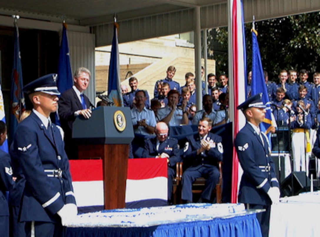 Surrounded by a sea of Air Force blue, President William J. Clinton addresses the audience at the Air Force's 50th Year Anniversary celebration in the Pentagon's center courtyard on Sept. 18,1997. The President then joined Secretary of Defense William Cohen, Secretary of the Air Force Sheila Widnall, U.S. Air Force Vice Chief of Staff General Ralph Eberhart, and Chief Master Sergeant of the Air Force Eric W. Benken, along with the 12 Outstanding Airman of the Air Force, in cutting a ceremonial cake. 