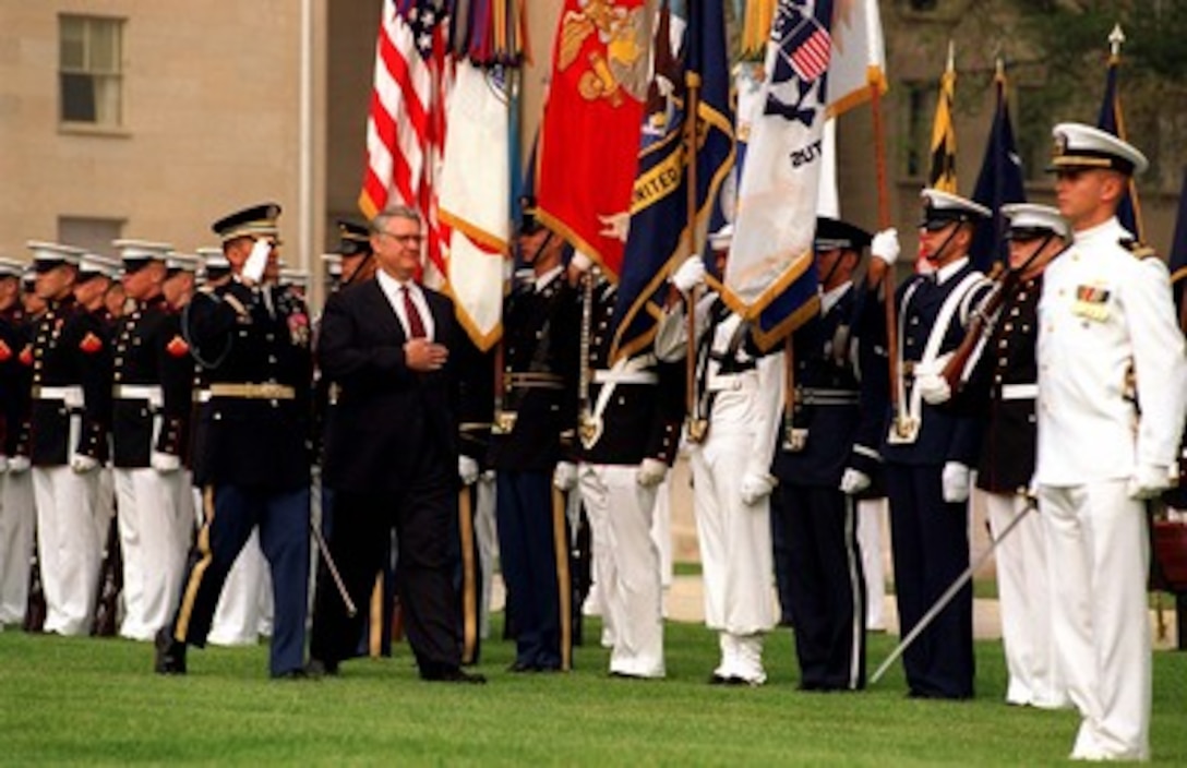 Col. Greg Gardner (left), U.S. Army, escorts Deputy Secretary of Defense John J. Hamre, as they inspect the troops at the Pentagon. Secretary of Defense William S. Cohen hosted the Full Honors Review and Welcoming Ceremony in honor of Hamre's new position on Sept. 8, 1997. Gardner is the Commander, 3rd U.S. Infantry (Old Guard). 