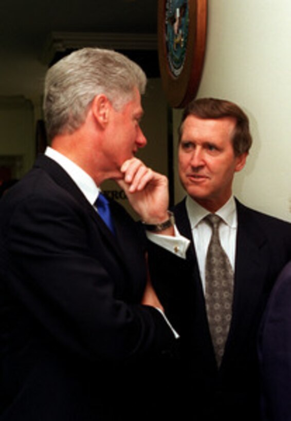 Secretary of Defense William S. Cohen (right) talks with President Bill Clinton (left) at the Pentagon on Sept. 18, 1997. Clinton and Cohen are taking part in the celebration of the 50th anniversary of the U.S. Air Force. 