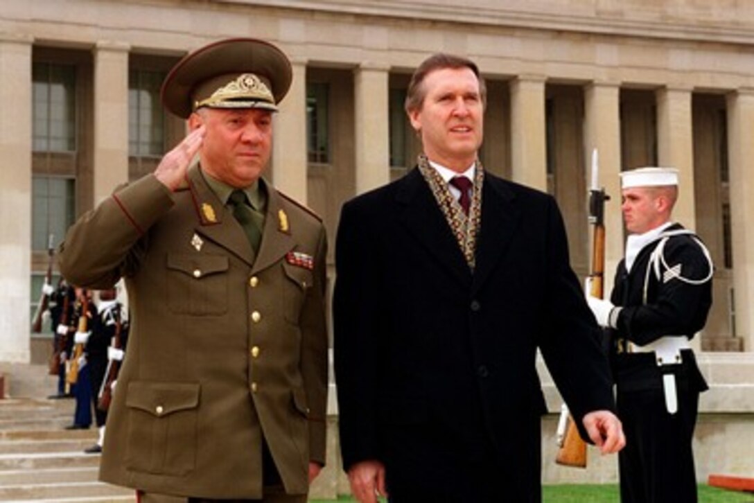 Secretary of Defense William S. Cohen (right) escorts Minister of Defense Gen. Lt. Vardiko Nadibaidze (left), of the Republic of Georgia, to an armed forces full honors arrival ceremony welcoming Nadibaidze to the Pentagon on March 24, 1998. 