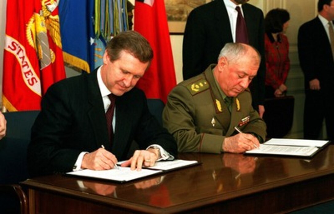 Secretary of Defense William S. Cohen (left) and Minister of Defense Gen. Lt. Vardiko Nadibaidze (right), of the Republic of Georgia, sign a U.S.-Georgia Defense Cooperation Plan in the Pentagon on March 24, 1998. The plan includes topics of Bilateral Arms Control, Regional Security Dialogue, Foreign Military Financing, Partnership for Peace, and air traffic control and air sovereignty policy and operations. 