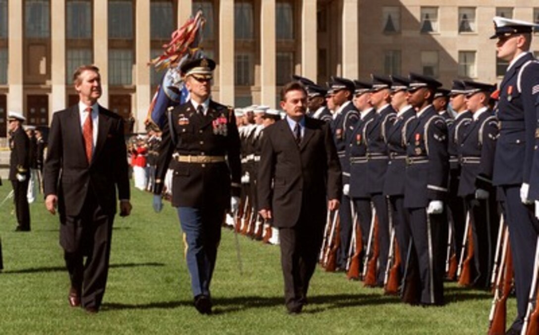 Secretary of Defense William S. Cohen (left) and Minister of Defense Lazar Kitanoski (right), of The Former Yugoslav Republic of Macedonia, inspect the joint honor guard at a full honor arrival ceremony welcoming Kitanoski to the Pentagon on April 6, 1998. Accompanying the two defense leaders is Commander of Troops, Col. Gregory Gardner, U.S. Army (center). Cohen and Kitanoski will later meet to discuss a range of security issues with the recent ethnic clashes in Kosovo, which borders The Former Yugoslav Republic of Macedonia, being high on the agenda. 