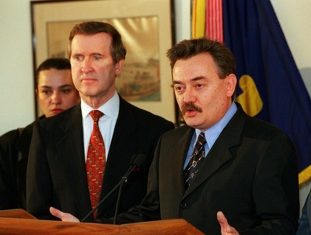 Minister of Defense Lazar Kitanoski (right), of The Former Yugoslav Republic of Macedonia, responds to a reporter's question as Secretary of Defense William S. Cohen (center) listens during a media availability in the Pentagon on April 6, 1998. Cohen and Kitanoski met to discuss a range of security issues with the recent ethnic clashes in Kosovo, which borders The Former Yugoslav Republic of Macedonia, being high on the agenda. 