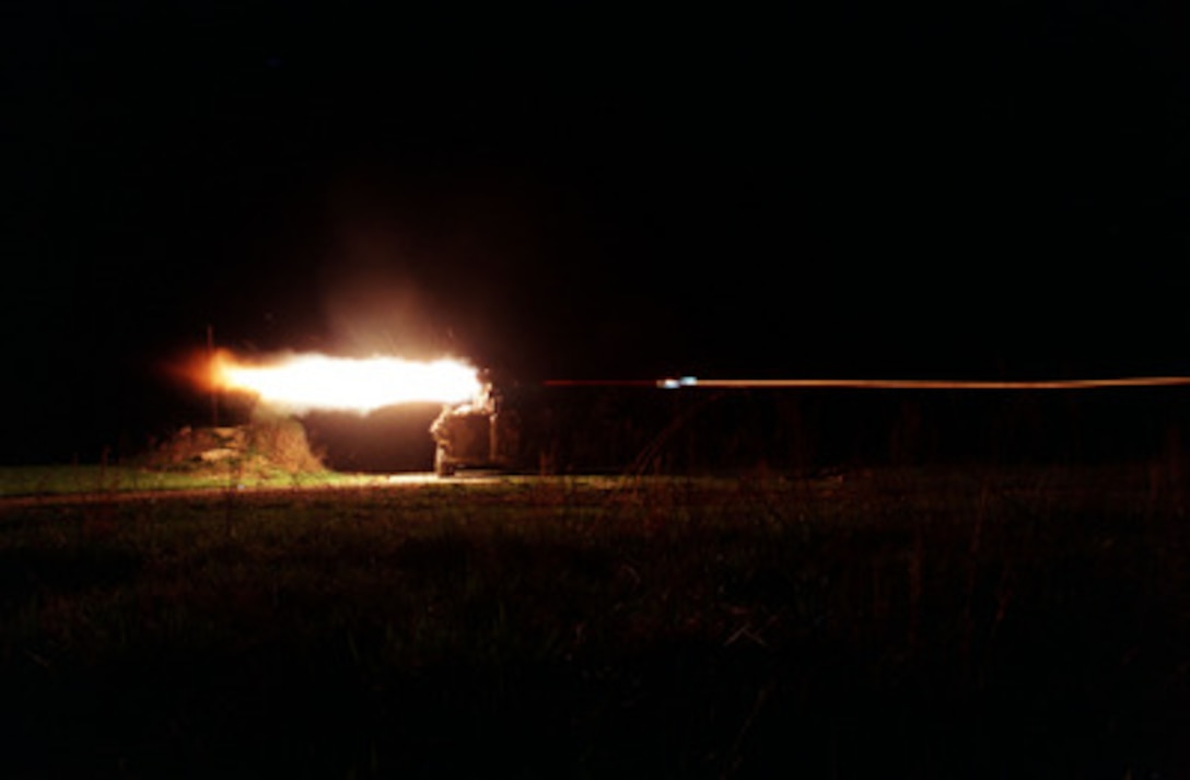 The blast from the rocket motor lights up the night as U.S. Marines fire a Tube launched, Optically tracked, Wire guided missile from their Light Armored Vehicle on the firing range during an exercise at Fort Pickett, Va., on March 30, 1998. The anti-armor missile, more commonly known as a TOW missile, is guided to its target by thin wires that transmit in flight corrections to the missile from the launcher. The Marines are attached to Delta Company, 3rd Platoon, 2nd Light Armored Reconnaissance Battalion, Camp Lejeune, N.C. 