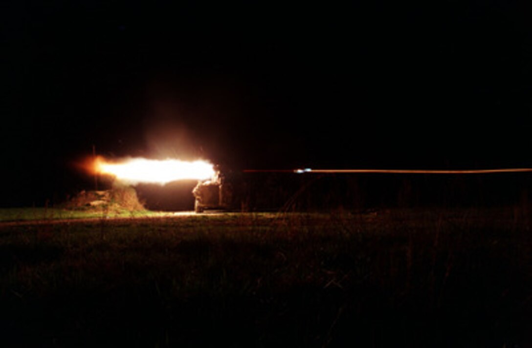 The blast from the rocket motor lights up the night as U.S. Marines fire a Tube launched, Optically tracked, Wire guided missile from their Light Armored Vehicle on the firing range during an exercise at Fort Pickett, Va., on March 30, 1998. The anti-armor missile, more commonly known as a TOW missile, is guided to its target by thin wires that transmit in flight corrections to the missile from the launcher. The Marines are attached to Delta Company, 3rd Platoon, 2nd Light Armored Reconnaissance Battalion, Camp Lejeune, N.C. 