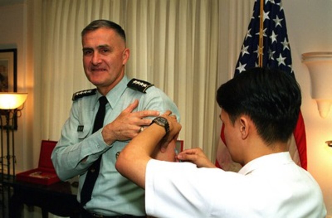 Chairman of the Joint Chiefs of Staff, Gen. Henry H. Shelton, U.S. Army, receives the third in a series of six inoculations against anthrax on April 1, 1998, in the Pentagon. 