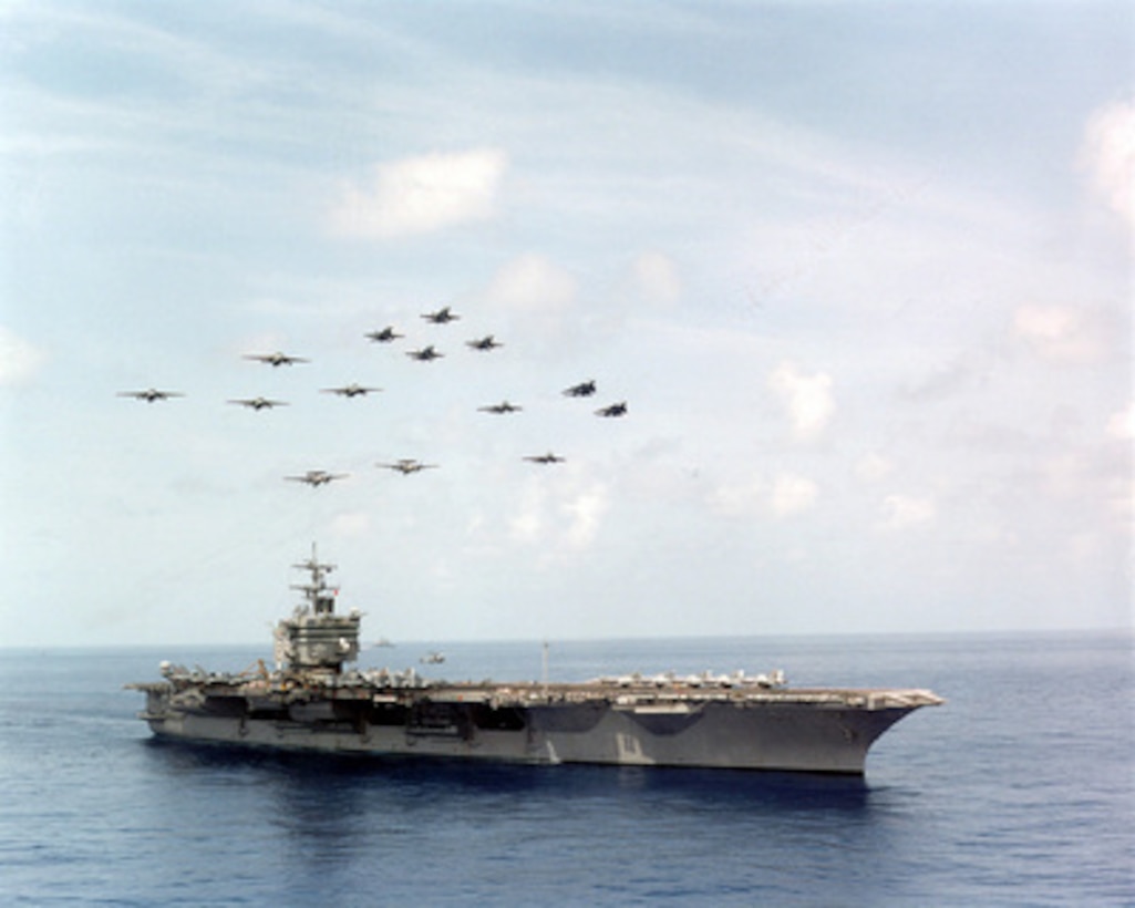 Carrier Air Wing Three (CVW-3) flies a diamond pattern formation over the aircraft carrier USS Enterprise (CVN 65). The Enterprise and CVW-3 are currently engaged in Composite Training Unit Exercise (COMPTUEX) in the Puerto Rico operating area. 