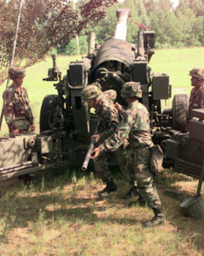 Soldiers from Charlie Company, 1/377th Field Artillery Regiment from Fort Bragg, N.C. make a dry run of firing their 155mm howitzer as part of the exercise Rapid Force Projection Initiative (RFPI). This exercise will be used to test equipment and its usefulness with the Light Forces on the battle field. 