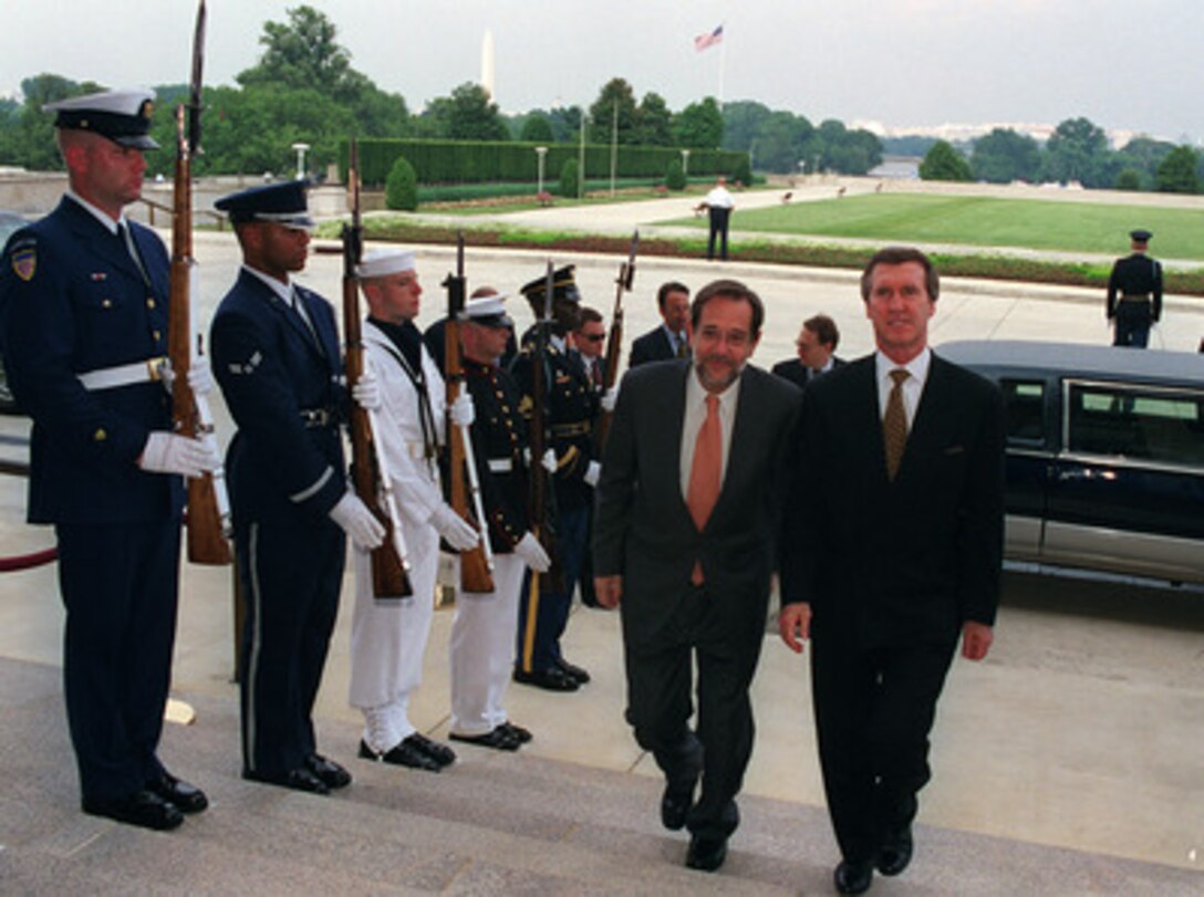Secretary of Defense William S. Cohen (right) escorts NATO Secretary General Javier Solana (left) into the Pentagon on July 16, 1998. 