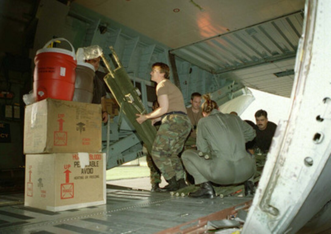 Members of the U.S. Air Force 86th Airlift Wing load relief supplies for the victims of the U.S. embassy bombings in Nairobi, Kenya, and Dar es Salaam, Tanzania, onto a C-141 Starlifter at Ramstein Air Base, Germany, on Aug. 7, 1998. 