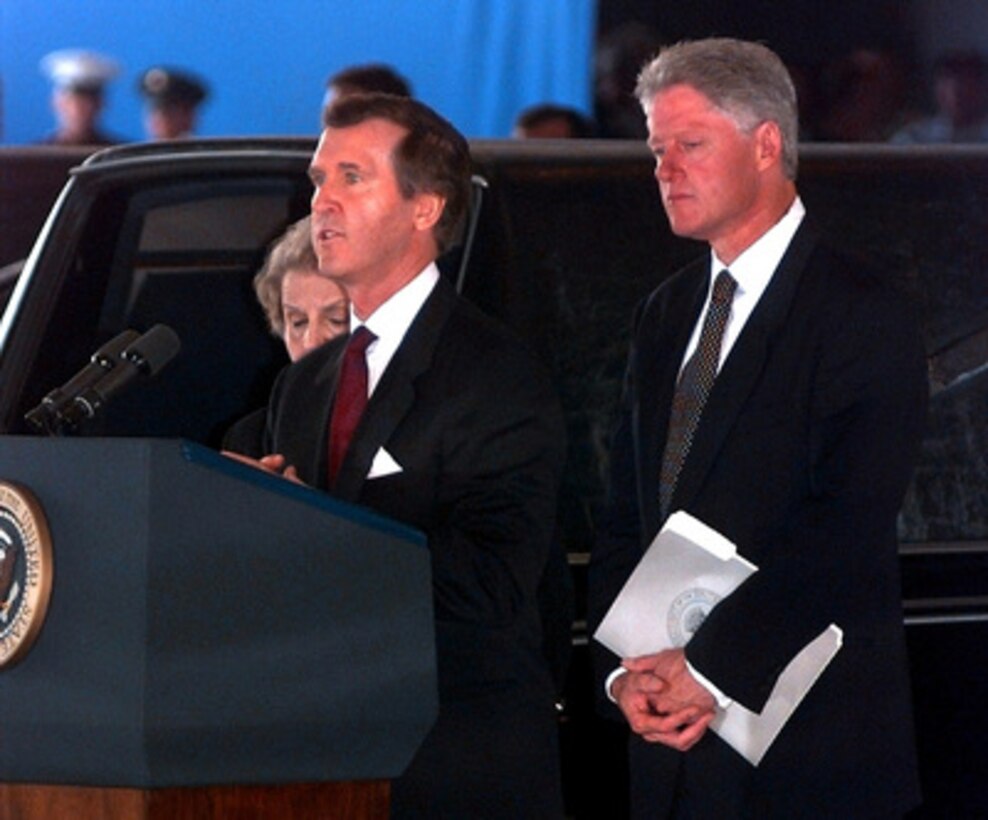 Secretary of Defense William Cohen (center) speaks at the ceremony honoring the victims of the bombing of the U.S. Embassy in Nairobi, Kenya, at Andrews Air Force Base, Md., on Aug. 13, 1998. Cohen was followed by Secretary of State Madeleine Albright (left) and President Bill Clinton (right). 