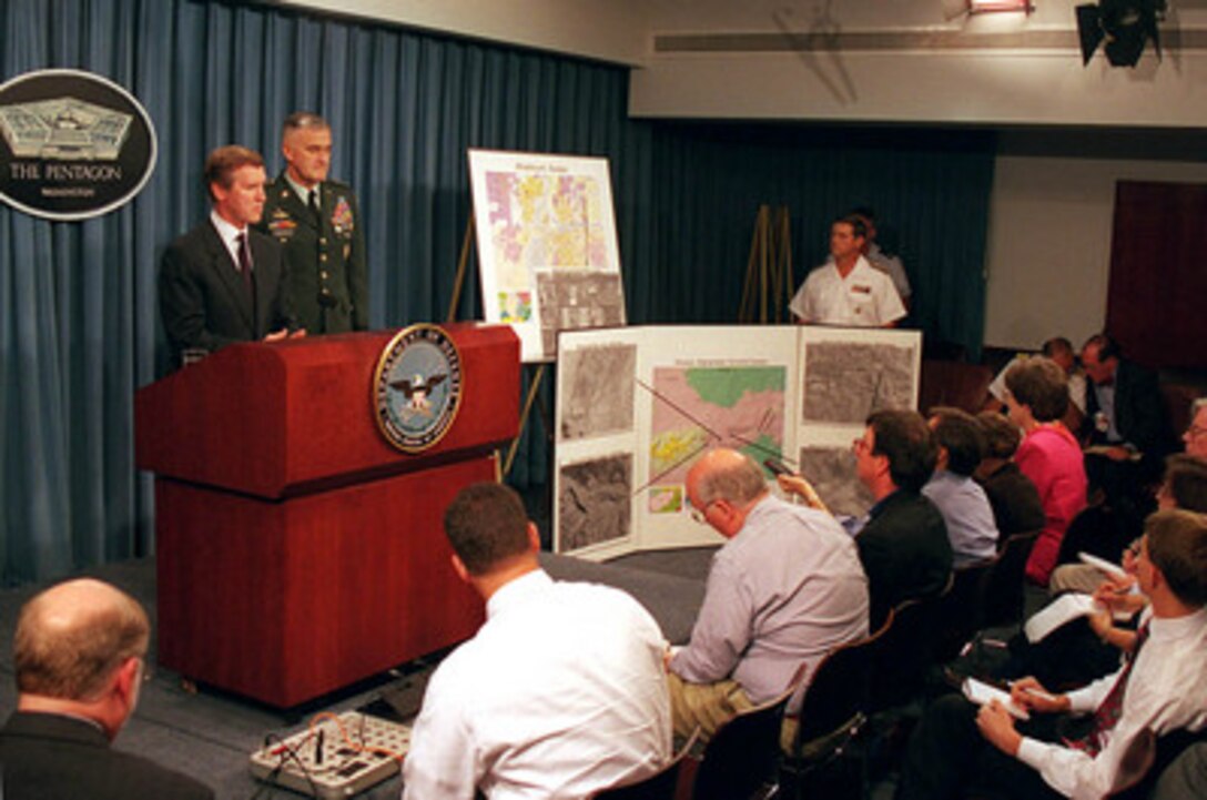 Secretary of Defense William S. Cohen (left) and Gen. Henry H. Shelton (right), U.S. Army, chairman, Joint Chiefs of Staff, brief reporters in the Pentagon on the U.S. military strike on a chemical weapons plant in Sudan and terrorist training camps in Afghanistan on Aug. 20, 1998. 