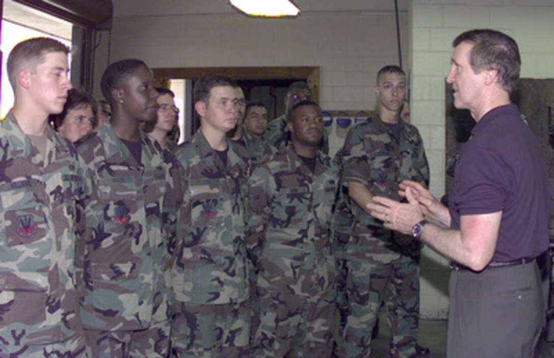 Secretary of Defense William S. Cohen (right) talks to the metals technicians of the 347th Equipment Maintenance Squadron, Moody Air Force Base, Ga., on Aug. 17, 1998. Cohen is on a fact-finding trip to Moody to learn from commanders and service members what they see as key problems facing the armed services. 