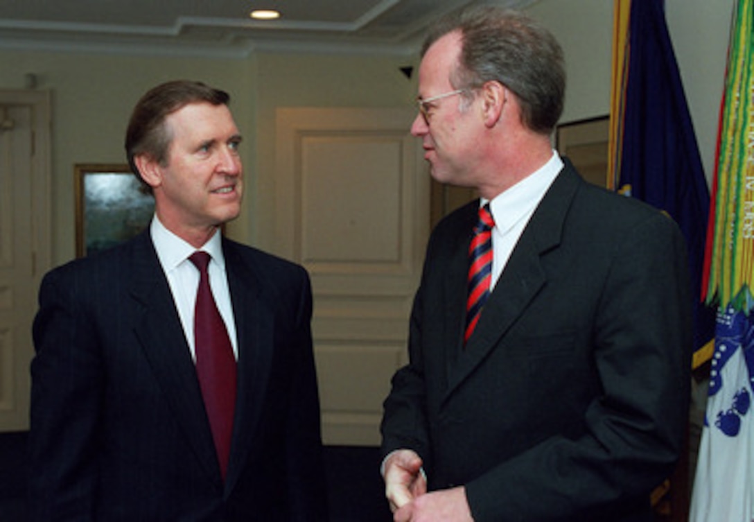 Secretary of Defense William Cohen (left) talks with visiting German Defense Minister Rudolf Scharping in the Pentagon, Nov. 24, 1998. 