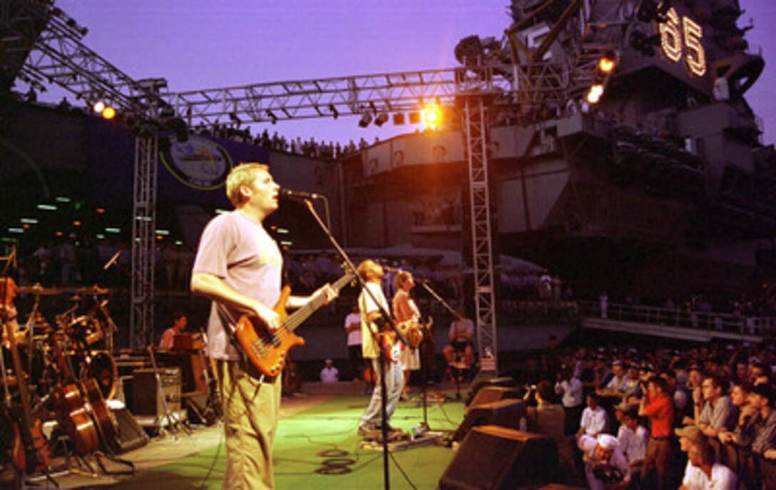 The rock group Hootie and the Blowfish perform a United Services Organization sponsored concert for the crew members of the USS Enterprise (CVN 65) while the ship is in port at Minas Jebel Ali, United Arab Emirates, on Dec. 5, 1998. Enterprise and its embarked Carrier Air Wing 3 are deployed to the Persian Gulf in support of Operation Southern Watch, which is the U.S. and coalition enforcement of the no-fly-zone over Southern Iraq. 