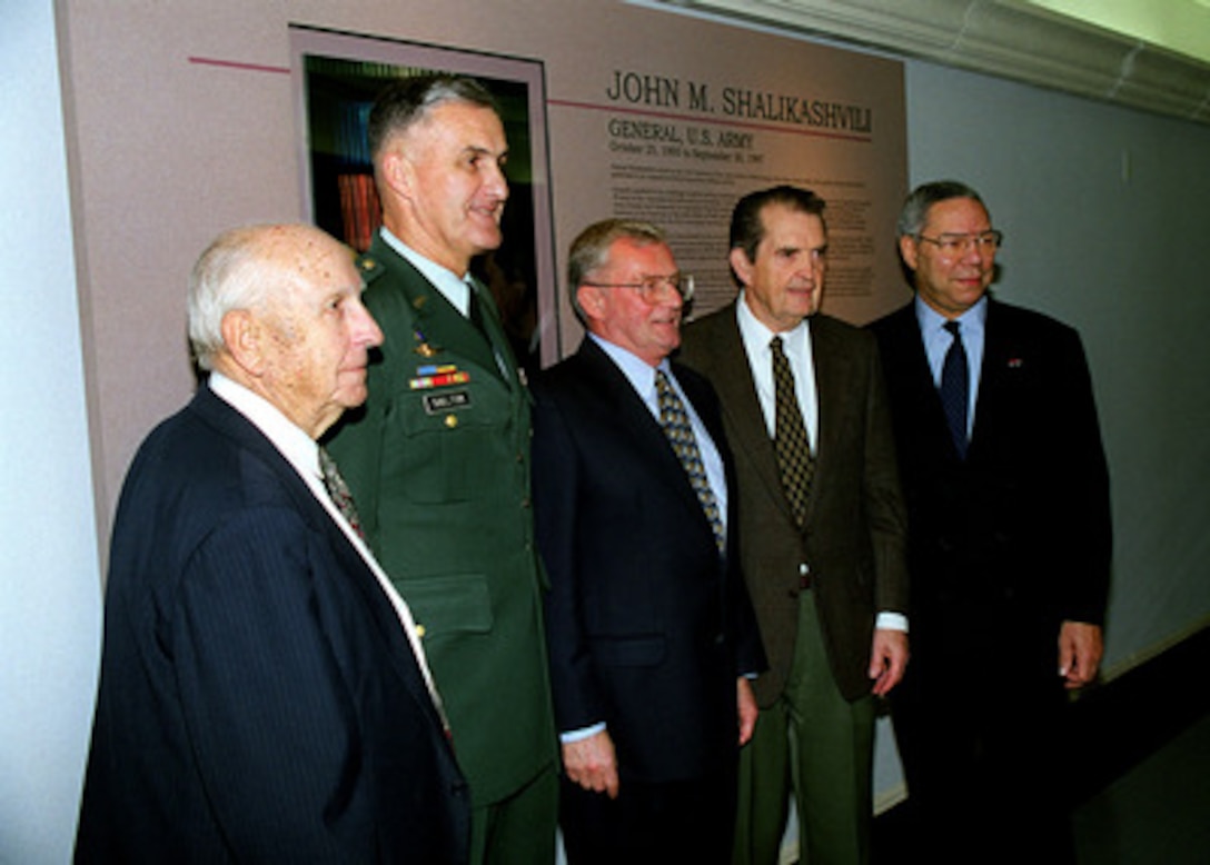 (Left to right) Retired Adm. Thomas H. Moorer, U.S. Navy, Chairman of the Joint Chiefs of Staff Gen. Henry H. Shelton, U.S. Army, retired Gen. John M. Shalikashvili, U.S. Army, retired Gen. David C. Jones, U.S. Air Force, and retired Gen. Colin L. Powell, U.S. Army, pose for photographers in the Chairmen's Corridor of the Pentagon on Dec. 7, 1998. The former and present chairmen are gathered for a ceremony to honor Shalikashvili with the unveiling of a panel depicting his career in the military and his rise to become the 13th chairman. 