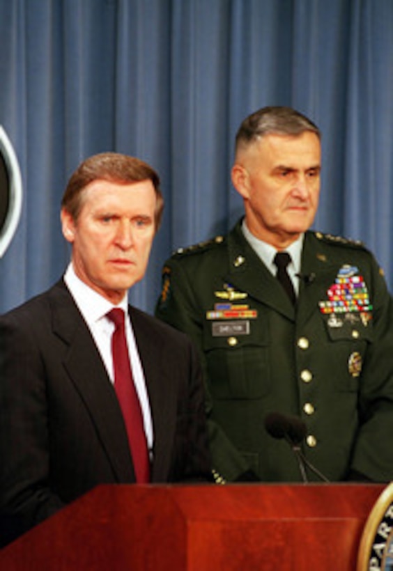 Secretary of Defense William S. Cohen (left) and Chairman of the Joint Chiefs of Staff Gen. Henry H. Shelton, U.S. Army, brief reporters in the Pentagon on the strikes in Iraq during Operation Desert Fox on Dec. 18, 1998. 