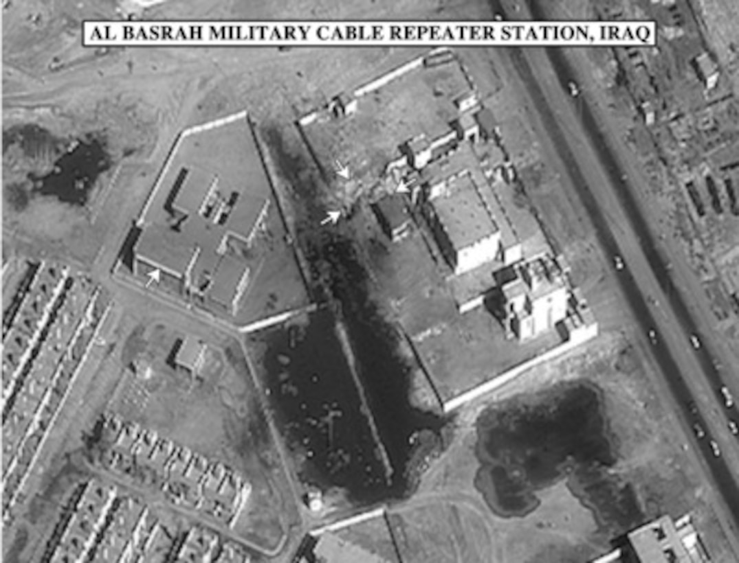 Bomb damage assessment photo of the Al Basrah Military Cable Repeater Station, Iraq, used by Gen. Anthony C. Zinni, U.S. Marine Corps, commander in chief, United States Central Command, during a press briefing in the Pentagon on Dec. 21, 1998. 