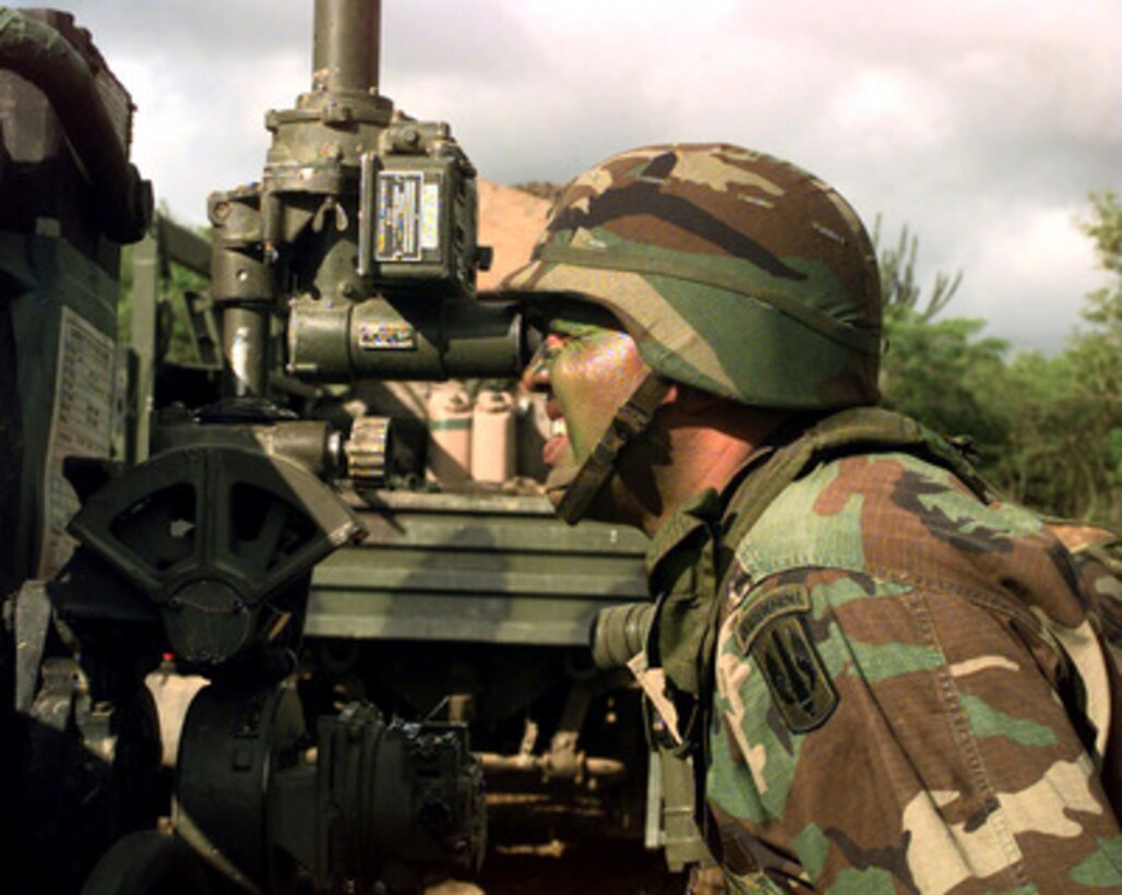Staff Sgt. Gregorio Santoni checks the zero coordinates for his section's M-198 155 mm howitzer, on Vieques Island, Puerto Rico, on Jan. 20, 1998, for Joint Task Force Exercise 98-1. More than 30,000 U.S. military personnel are participating in the exercise which is testing joint forces on their ability to deploy rapidly and conduct joint operations during a crisis. All branches of the armed forces are training side-by-side using the latest advances in technology in a simulated high-threat environment that involves air, naval and ground operations. Santoni's unit, B Battery, 1st Battalion, 377th Field Artillery Regiment (Air Assault), Fort Bragg, N.C., will conduct a joint, live fire exercise with the 26th Marine Expeditionary Unit of Camp Lejeune, N.C. 