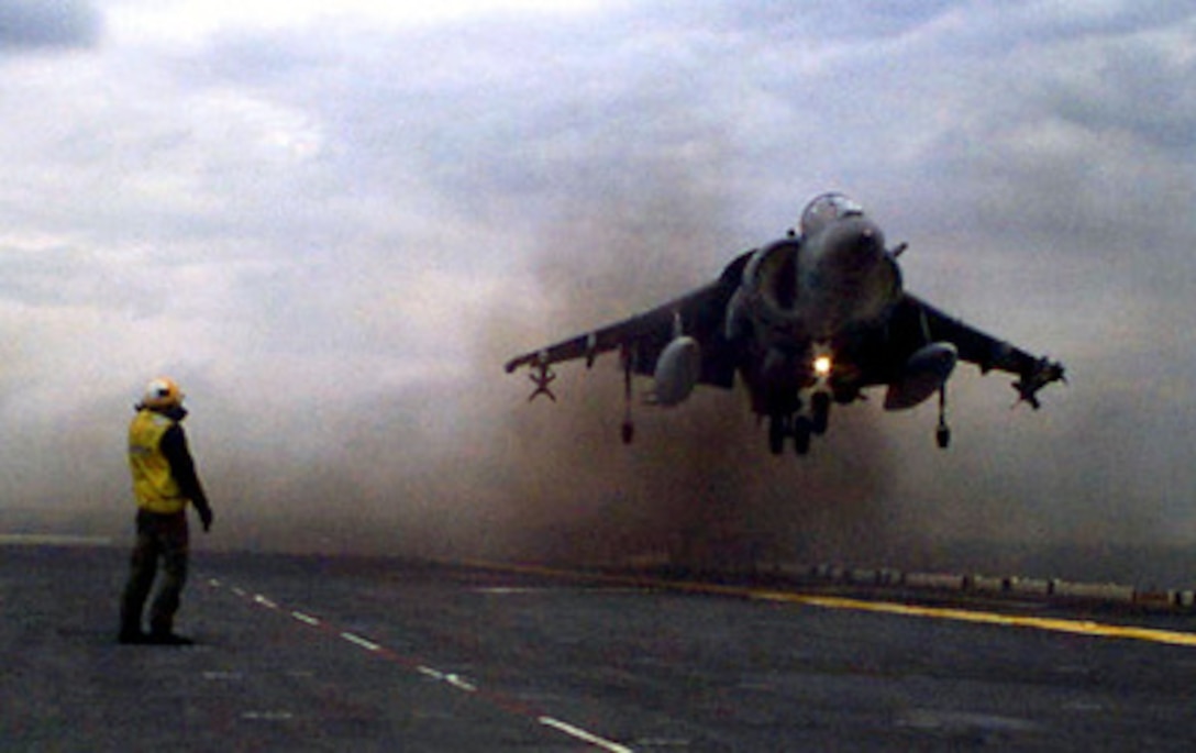 A U.S. Marine Corps AV-8B Harrier Lands On Board The Amphibious Assault ...