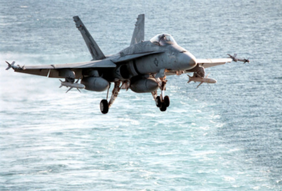 A U.S. Marine Corps F/A-18C Hornet comes in on final approach to land on the flight deck of the USS George Washington (CVN 73) as the ship steams in the Persian Gulf on Feb. 6, 1998. The aircraft is loaded with AIM-9 Sidewinder short range, and AIM-7 Sparrow medium range air-to-air missiles. Additionally under each wing are AGM-88 HARM air-to-ground anti-radar missiles. The Washington battle group is operating in the Persian Gulf in support of Operation Southern Watch which is the U.S. and coalition enforcement of the no-fly-zone over Southern Iraq. The Hornet is attached to Fighter-Attack Squadron 251 from Marine Corps Air Station Beaufort, S.C. 