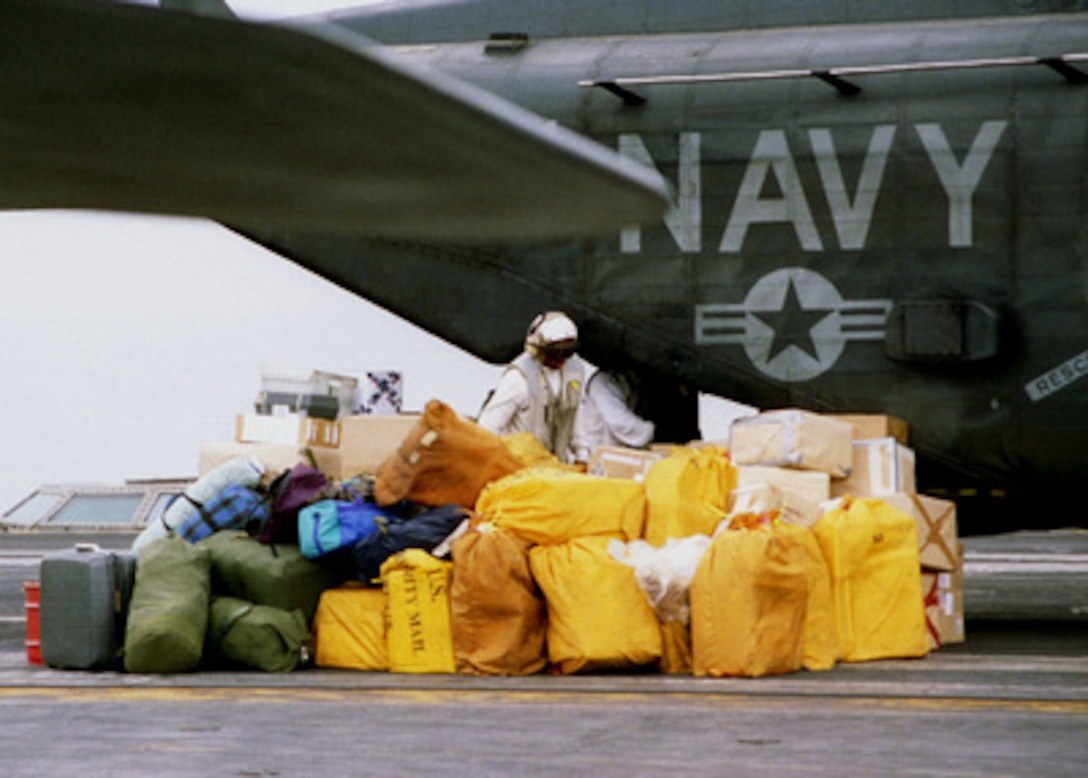 Sacks of the sailor's favorite cargo--mail--are unloaded from a CH-53 Sea Stallion helicopter on the flight deck of the USS Nimitz (CVN 68) as the ship steams in the Persian Gulf on Feb. 7, 1998. Nimitz and her embarked Carrier Air Wing 9 are conducting sustained operations in the Persian Gulf in support of Operation Southern Watch which is the U.S. and coalition enforcement of the no-fly-zone over Southern Iraq. 