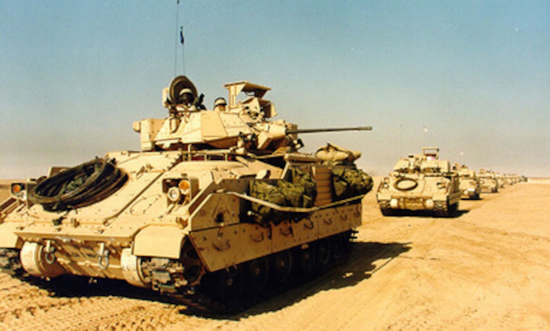 M-2A2 Bradley Fighting Vehicles roll out from the Kabal to a training area in the Udairi Range in Kuwait on Jan. 20, 1998. Nearly 1,500 U.S. soldiers are participating with members of the Kuwaiti armed forces in Exercise Intrinsic Action 98-1. The exercise is intended to strengthen military-to-military relationships, improve readiness and interoperability between U.S. and Kuwaiti armed forces, and to enhance U.S. military force capabilities to deploy quickly to the region. 