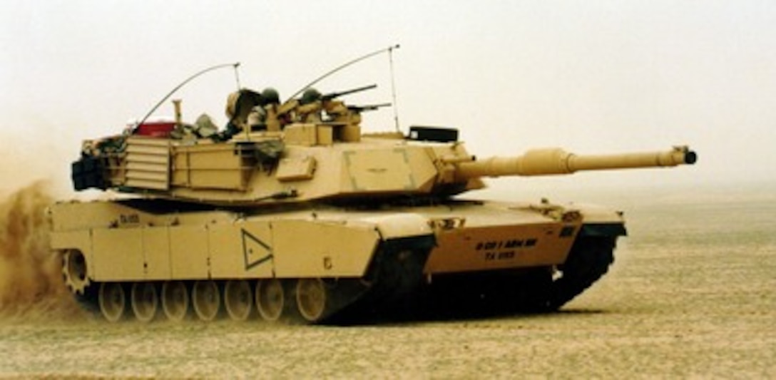 A M-1A1 Abrams main battle tank advances across the Kuwaiti desert on Jan. 20, 1998, rehearsing techniques and coordination drills in preparation for Exercise Intrinsic Action 98-1. Nearly 1,500 U.S. soldiers are participating with members of the Kuwaiti armed forces in Intrinsic Action. The exercise is intended to strengthen military-to-military relationships, improve readiness and interoperability between U.S. and Kuwaiti armed forces, and to enhance U.S. military force capabilities to deploy quickly to the region. 