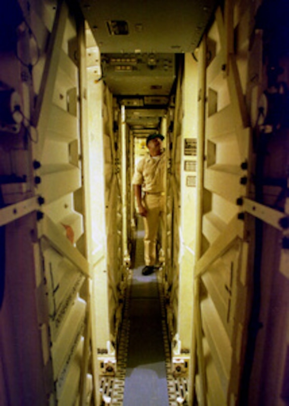 Chief Petty Officer Jackie Staton inspects the Tomahawk missile launch tubes aboard the Spruance-class destroyer USS John Young (DD 973) as the ship operates in the Persian Gulf on Feb. 9, 1998. The John Young is deployed from its homeport of San Diego, Calif., to the Persian Gulf in support of Operation Southern Watch which is the U.S. and coalition enforcement of the no-fly-zone over Southern Iraq. Staton is a Navy gunner's mate. 