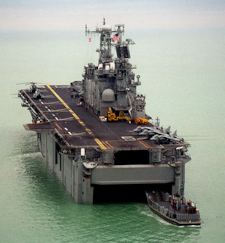 Landing Craft, Utility 1633 backs out of the well deck of the amphibious assault ship USS Peleliu (LHA 5) as it heads for the beach in Kuwait for another load of personnel and equipment on Jan. 4, 1998. The Peleliu Amphibious Readiness Group is participating in Exercise Eager Mace 98, a joint, combined, amphibious, ground, air, and naval training exercise with Kuwaiti Armed Forces. The exercise has been scheduled for some time and is one of many military exercises that U.S. Central Command regularly conducts throughout the central region. 