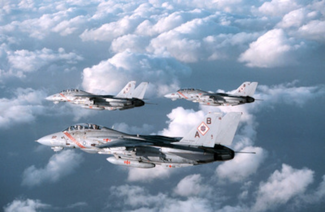 Three U.S. Navy F-14B Tomcats from Fighter Squadron 102 patrol the sky over the Persian Gulf on Feb. 11, 1998. The Tomcats are operating off of the aircraft carrier USS George Washington (CVN 73). The Washington battle group is operating in the Persian Gulf in support of Operation Southern Watch which is the U.S. and coalition enforcement of the no-fly-zone over Southern Iraq. Fighter Squadron 102 is deployed to the Washington from Naval Air Station Oceana, Va. 