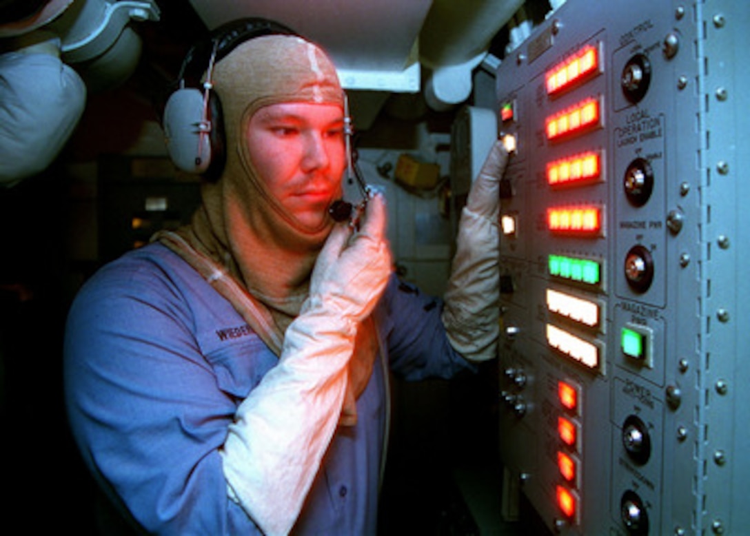 U.S. Navy Petty Officer 3rd Class John Wiederhold tests a Vertical Launch System panel aboard the guided missile destroyer USS John S. McCain (DDG 56) on Feb. 11, 1998. The McCain is operating in the Persian Gulf in support of Operation Southern Watch which is the U.S. and coalition enforcement of the no-fly-zone over Southern Iraq. Wiederhold is a Navy gunner's mate. 