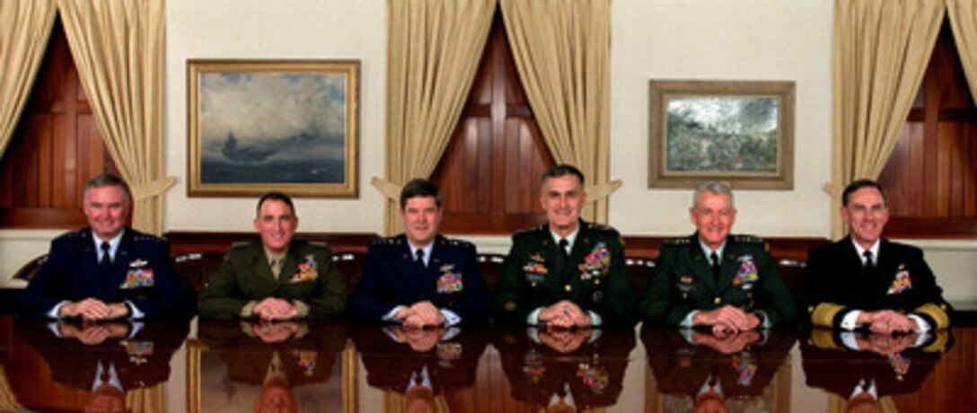 The Joint Chiefs of Staff, photographed in their traditional meeting place, the JCS Gold Room at the Pentagon on Dec. 18, 1997. From left to right are: Gen. Michael E. Ryan, U.S. Air Force chief of staff; Gen. Charles C. Krulak, U.S. Marine Corps, commandant; Gen. Joseph W. Ralston, U.S. Air Force, vice chairman of the Joint Chiefs of Staff; Gen. Henry H. Shelton, U.S. Army, chairman of the Joint Chiefs of Staff; Gen. Dennis J. Reimer, U.S. Army, chief of staff; Adm. Jay L. Johnson, U.S. Navy, chief of naval operations. 