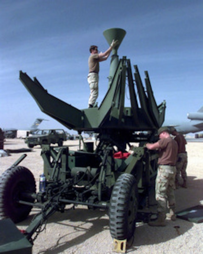 U.S. Air Force personnel from the 51st, 52nd and the 54th Combat Communications Squadrons set up a 20 foot Quick Reaction Satellite Antenna at an operating base in Southwest Asia on Feb. 16, 1998. Over 400 U.S. Air Force personnel are deployed to the Gulf region as part of an Air Mobility Command Tanker Task Force operating in the Southwest Asia theater in support of Operation Southern Watch. Southern Watch is the U.S. and coalition enforcement of the no-fly-zone over Southern Iraq. The antenna will give the deployed Tanker Task Force direct, worldwide communications. The 51st, 52nd and the 54th are deployed from Robins Air Force Base, Ga. 