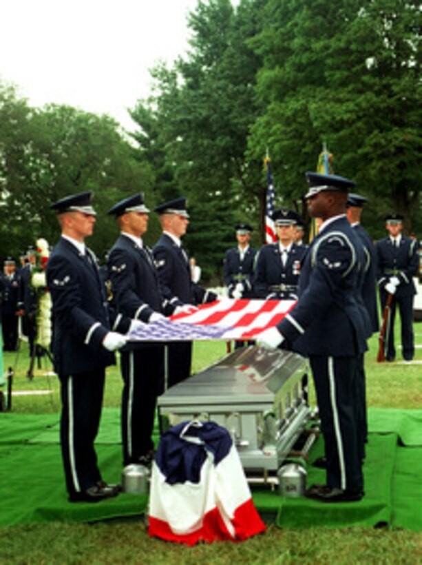 Members of the Air Force Honor Guard prepare to fold the flag during funeral services honoring U.S. Air Force 1st Lt. Michael Blassie on July 11, 1998, at Jefferson Barracks National Cemetery, south of St. Louis, Mo. The Blassie family laid Michael to rest after 14 years of being in the Tomb of the Unknowns as the Vietnam Unknown. Blassie was flying an A-37 attack aircraft when he was shot down near An Loc, South Vietnam on May 11, 1972, at the age of 24. 