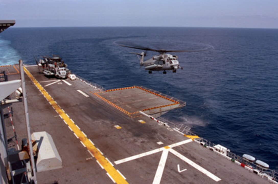 A CH-53 Super Stallion helicopter lands on the deck of the USS Nassau off the coast of Halifax, Nova Scotia. The CH-53 was operating in support of Unified Spirit '98, a maritime combined operational training exercise. The exercise includes forces from Canada, Denmark, the United Kingdom, France, the United States, and other NATO nations. It provides effective, realistic training to improve the skills needed during a NATO led peacekeeping support operation. 